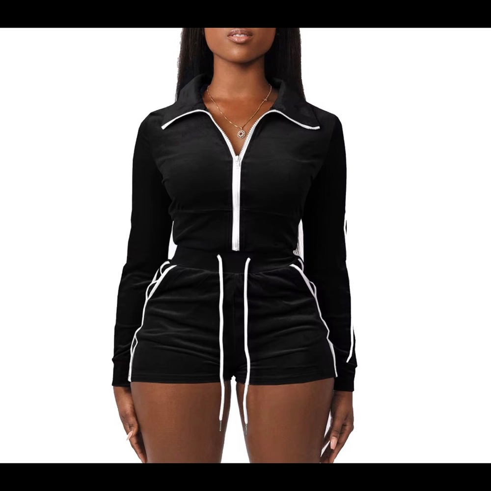 Black velvet two piece high waisted shorts and cropped jacket.